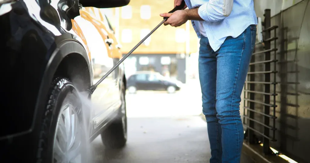 Manual Car Wash With Pressurized Water In Car Wash